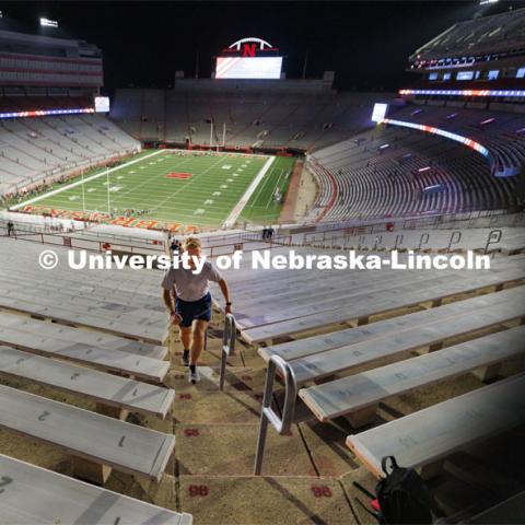 UNL Air Force cadets run up the long south stadium steps. More than 160 UNL ROTC cadets along with active-duty military personnel, local first responders and UNO Air Force ROTC cadets ran 2200 steps in Memorial Stadium today. The run honors the first responders who ran up the 110 floors of the World Trade Center on 9/11. September 8, 2022. Photo by Craig Chandler / University Communication.