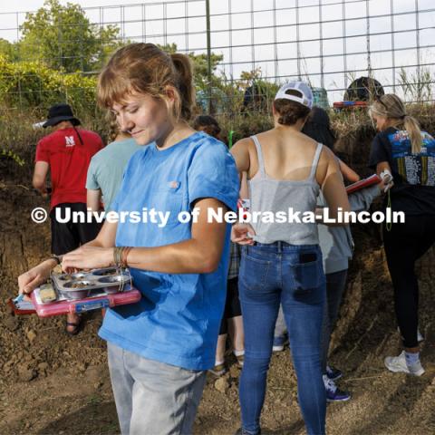 Kennadi Griffis sifts through a soil sample in the soil judging pit on East Campus. Griffis’ curiosity about the natural environment and the opportunities she found at the University of Nebraska–Lincoln propelled the Husker to an international championship in soil judging as a member of Team USA. September 9, 2022. Photo by Craig Chandler / University Communication.