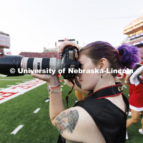 Madison Vinci, a sports media major in the College of Journalism and Mass Communication, photographs the game. Nebraska vs. Georgia Southern football in Memorial Stadium. September 10, 2022. Photo by Craig Chandler / University Communication.