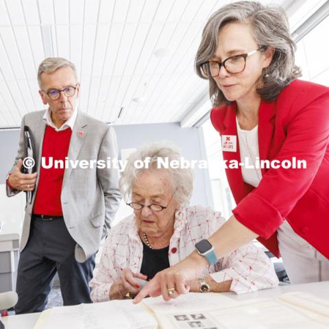 Ruth Scott looks over correspondence from George Beadle that reside in the UNL Library Special Collections. Universities Libraries Claire Stewart points out a name as Chancellor Ronnie Green looks on. Bill and Ruth Scott were honored at the dedication of the George Beadle statue at the Dinsdale Learning Commons on East Campus. September 13, 2022. Photo by Craig Chandler / University Communication.