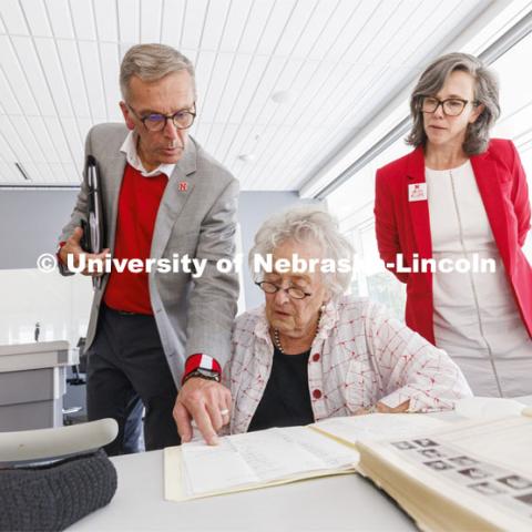 Ruth Scott looks over correspondence from George Beadle that reside in the UNL Library Special Collections. Chancellor Ronnie Green points out a name as Universities Libraries Claire Stewart looks on. Bill and Ruth Scott were honored at the dedication of the George Beadle statue at the Dinsdale Learning Commons on East Campus. September 13, 2022. Photo by Craig Chandler / University Communication.