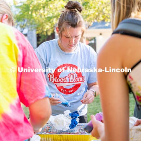 Students tie-dye “Peace, Love, Consent” t-shirt (while supplies last) and visit booths to learn more about CONSENT and how to ask for it. The event was sponsored by Center for Advocacy, Response and Education (CARE) and Big Red Resilience and Well-being. September 20, 2022. Photo by Jonah Tran/ University Communication.