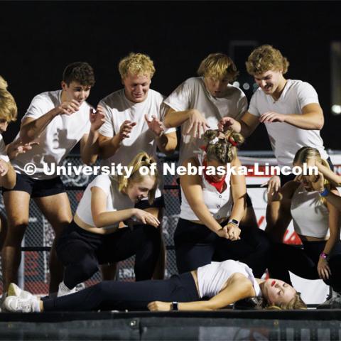 Members of Triad 6 (Alpha Tau Omega and Chi Omega) bring a performer to life on stage at Showtime at Vine Street Fields. Showtime at the Vine Street Fields. Recognized Student Organizations, Greeks and Residence Halls battle against each other with performances for Homecoming competition points and ultimate bragging rights. Homecoming 2022. September 26, 2022. Photo by Craig Chandler / University Communication.