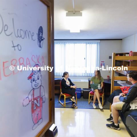 Students socializing in their dorm rooms. Housing Photo Shoot in Able Sandoz Residence Hall. September 27, 2022. Photo by Craig Chandler / University Communication.