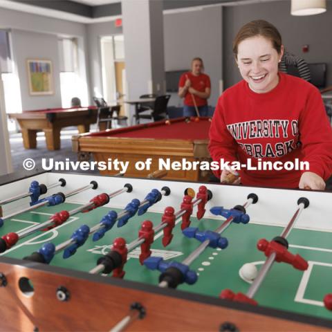 Students playing foosball. Housing Photo Shoot in Able Sandoz Residence Hall. September 27, 2022. Photo by Craig Chandler / University Communication.