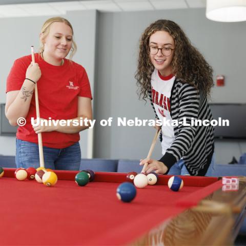 Students playing a game of pool. Housing Photo Shoot in Able Sandoz Residence Hall. September 27, 2022. Photo by Craig Chandler / University Communication.