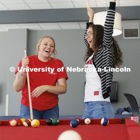 Students playing a game of pool. Housing Photo Shoot in Able Sandoz Residence Hall. September 27, 2022. Photo by Craig Chandler / University Communication.