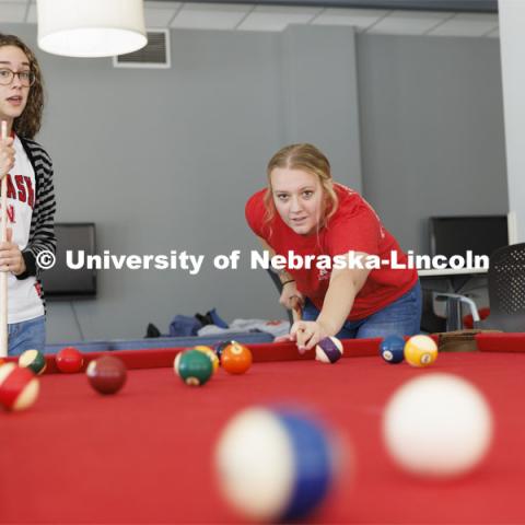 Students playing a game of pool. Housing Photo Shoot in Able Sandoz Residence Hall. September 27, 2022. Photo by Craig Chandler / University Communication.
