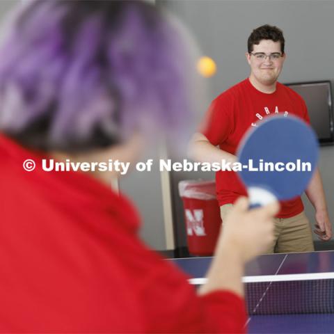 Students playing a game of ping-pong. Housing Photo Shoot in Able Sandoz Residence Hall. September 27, 2022. Photo by Craig Chandler / University Communication.