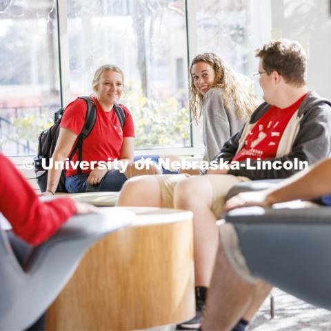 Student socializing in a commons area. Housing Photo Shoot in Able Sandoz Residence Hall. September 27, 2022. Photo by Craig Chandler / University Communication.