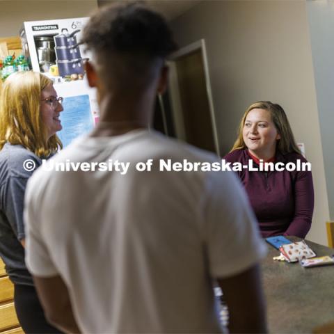 Students socializing in an apartment style room in The Courtyards Residence Hall. Housing Photo Shoot in The Courtyards Residence Hall. September 27, 2022. Photo by Craig Chandler / University Communication.