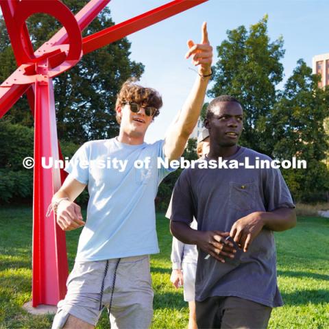 Kappa Sigma Fraternity member points to his fraternity brother where the next location in their race will be at the Homecoming Traditions Race. The Traditions Race will consist of clues leading to 10-15 traditions around campus, and the first three teams to find every tradition will be declared winners! September 27, 2022. Photo by Dillon Galloway for University Communication.