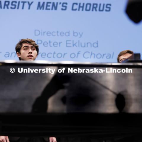 Peter Eklund’s shadow falls on the side of the piano as he directs the Varsity Men’s Chorus to open the 2022 State of Our University address. September 28, 2022. Photo by Craig Chandler / University Communication.