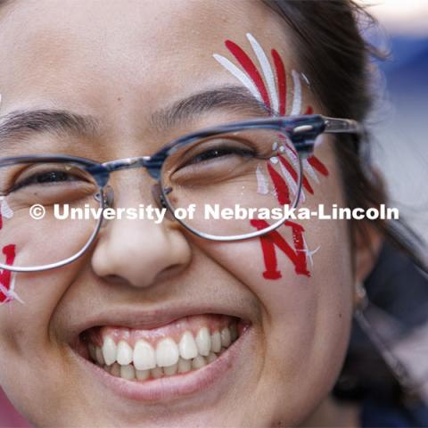 Jenny Nguyen shows off her face-painted spirit. Homecoming Parade and Cornstalk. September 30, 2022. Photo by Craig Chandler / University Communication.