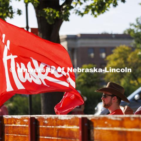 Jake Jundt a former Husker Cheer squad member and current assistant with the team, awaits the start of the parade.  He drove an antique International Harvester tractor his family owns and pulled Herbie Husker and Lil’ Red in a trailer. Homecoming Parade and Cornstalk. September 30, 2022. Photo by Craig Chandler / University Communication.