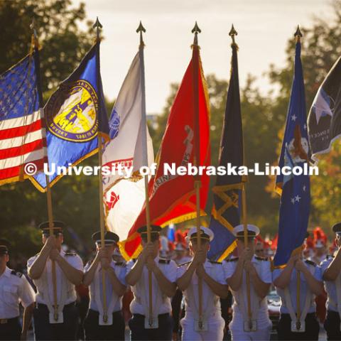 The ROTC color guard marches down R Street. Homecoming Parade and Cornstalk. September 30, 2022. Photo by Craig Chandler / University Communication.