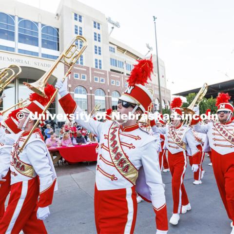 The Cornhusker Marching Band shows their spirit as they march past the judges table in front of Memorial Stadium. Homecoming Parade and Cornstalk. September 30, 2022. Photo by Craig Chandler / University Communication.