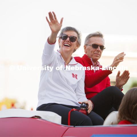 Jane Green waves to the crowd as she and Chancellor Ronnie Green served as grand marshals of the parade Friday evening. Homecoming Parade and Cornstalk. September 30, 2022. Photo by Sammy Smith for University Communication.