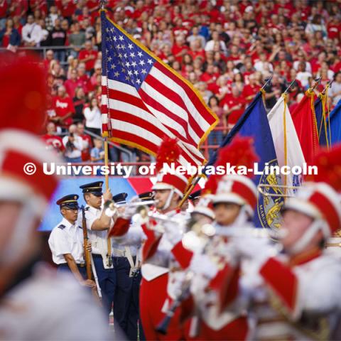 The Cornhusker Marching Band plays as the ROTC Colorguard march in. Nebraska vs. Indiana football Homecoming game. October 1, 2022. Photo by Craig Chandler / University Communication.