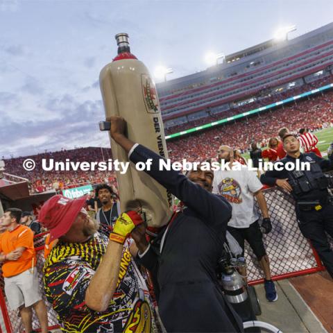 Members of the Homecoming Court get the chance to launch a hotdog with Der Viener Schlinger. Nebraska vs. Indiana football Homecoming game. October 1, 2022. Photo by Craig Chandler / University Communication.