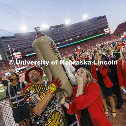 Members of the Homecoming Court get the chance to launch a hotdog with Der Viener Schlinger. Nebraska vs. Indiana football Homecoming game. October 1, 2022. Photo by Craig Chandler / University Communication.