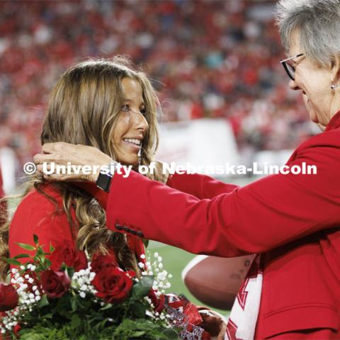 Newly crowned homecoming royalty Emily Hatterman has a medallion placed over her by Jane Green. Nebraska vs. Indiana football Homecoming game. October 1, 2022. Photo by Craig Chandler / University Communication.