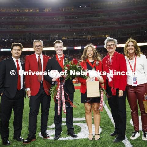 Newly crowned homecoming royalty Jacob Drake and Emily Hatterman are joined with (from left) 2021 royalty Bobby Martin, Chancellor Ronnie Green, Jane Green and Nebraska Alumni Executive Director Shelley Zaborowski. Nebraska vs. Indiana football Homecoming game. October 1, 2022. Photo by Craig Chandler / University Communication.