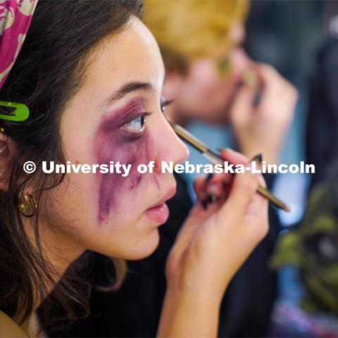 Aurora Villarreal applies stage makeup before the Shakesfear Haunted house on October 12. As a longtime horror fan and recent Shakespeare convert, senior theatre performance major Aurora Villarreal sees their opportunity to play Lady Macbeth in UNL Repertory Theatre’s ShakesFEAR production as a particularly exciting — and unique — acting experience. October 12, 2022. Photo by Dillon Galloway for University Communication.