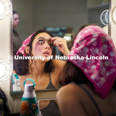 Aurora Villarreal applies stage makeup before the Shakesfear Haunted house on October 12. As a longtime horror fan and recent Shakespeare convert, senior theatre performance major Aurora Villarreal sees their opportunity to play Lady Macbeth in UNL Repertory Theatre’s ShakesFEAR production as a particularly exciting — and unique — acting experience. October 12, 2022. Photo by Dillon Galloway for University Communication.