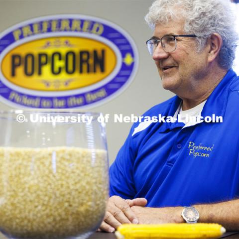 Interviewed in his company office’s conference room, Norm Krug co-founded Preferred Popcorn, wondered whether he would eventually tire of the snack. Nearly 25 years later, “I still love it and consume it every day.” Preferred Popcorn grows popcorn near Chapman, Nebraska and throughout the area. It is headed by Norm Krug. October 13, 2022. Photo by Craig Chandler / University Communication.