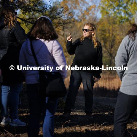 Sophia Perdikaris talks with academic counselors on a tour of Reller Prairie in southwest Lancaster County. October 17, 2022. Photo by Craig Chandler / University Communication.