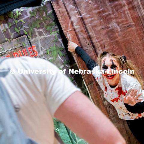 Student and performer, Madison Garrow, greets students as they enter the haunted house at the Husker Haunt in the Nebraska East Union. October 20, 2022. Photo by Jonah Tran / University Communication.