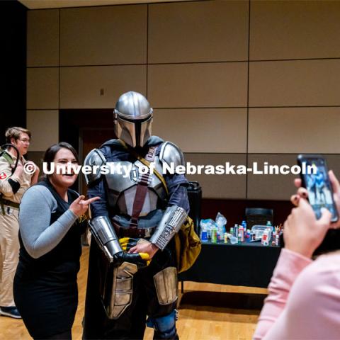 Students pose with Ben Ferguson dressed up as the Mandalorian at the Husker Haunt in the Nebraska East Union. October 20, 2022. Photo by Jonah Tran/ University Communication.