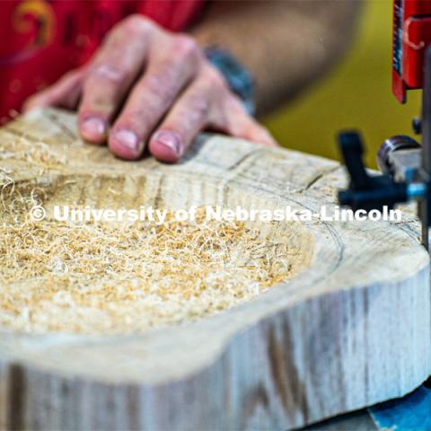 A buildup of wood shavings from the band saw. Architecture design professor Aziza Cyamani is doing a weekend long furniture design-build sprint with Professor Chris Martin from Iowa State University. The students will come Friday, Saturday and Sunday and make something out of wood and another version using a new technology like 3D printing. October 30, 2022. Photo by Kirk Rangel for University Communication.