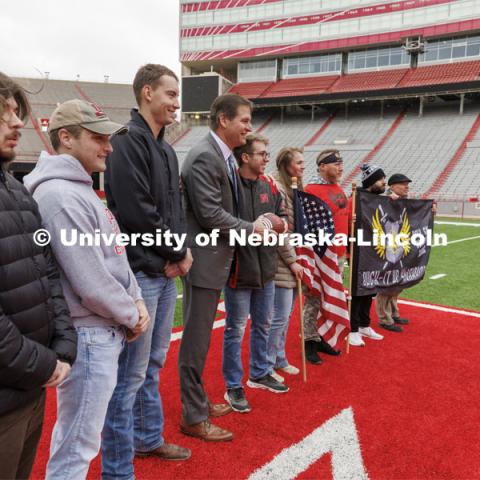 Nebraska Athletic Director Trev Alberts hands over the game ball that will be part of the Ruck March and walked to the Iowa game. November 15, 2022. Photo by Craig Chandler / University Communication.