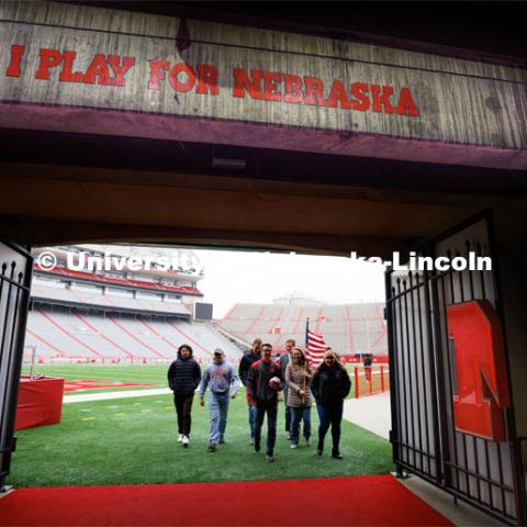 Student Ruck Marchers, leave the Memorial Stadium field after Nebraska Athletic Director Trev Alberts presented the game ball that will be part of the Ruck March. November 15, 2022. Photo by Craig Chandler / University Communication.