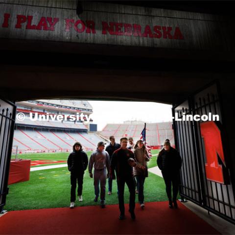 Student Ruck Marchers, leave the Memorial Stadium field after Nebraska Athletic Director Trev Alberts presented the game ball that will be part of the Ruck March. November 15, 2022. Photo by Craig Chandler / University Communication.