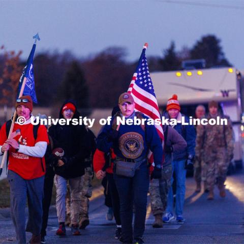 Ruck Marchers begin the march going east through the Veterans Tribute and along Vine street. From left is UNL alumni and veteran Connor Williams and Midshipman Cohan Bonow. Nebraska students and veterans march from Memorial Stadium Wednesday morning. "The Things They Carry" ruck march involving military and veteran students from Iowa and Nebraska. To raise awareness about veteran suicide, through the week, the students walk in 20-mile shifts carrying 20-pound backpacks to commemorate the estimated 20 veterans who die by suicide each day. November 15, 2022. Photo by Craig Chandler / University Communication.