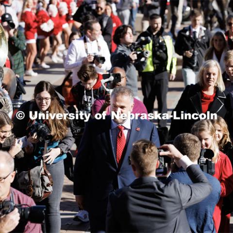 Husker head football coach Matt Rhule is surrounded as he enters east stadium Monday. Rhule is introduced at a press conference in the Hawks Championship Center. November 28, 2022. Photo by Craig Chandler / University Communication.