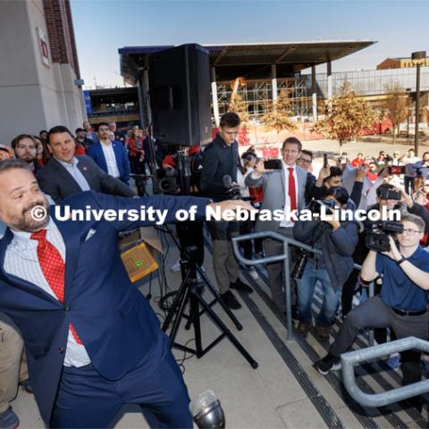 Husker head football coach Matt Rhule throws out one of five footballs to the crowd outside East Stadium. Rhule is introduced at a press conference in the Hawks Championship Center. November 28, 2022. Photo by Craig Chandler / University Communication.