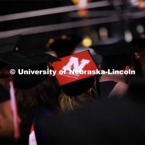 Decorated mortarboard. Graduate Commencement in Pinnacle Bank Arena. December 16, 2022. Photo by Craig Chandler / University Communication.