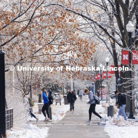 Students crossing campus. Ice and snow cover campus. January 19, 2023. Photo by Craig Chandler / University Communication.