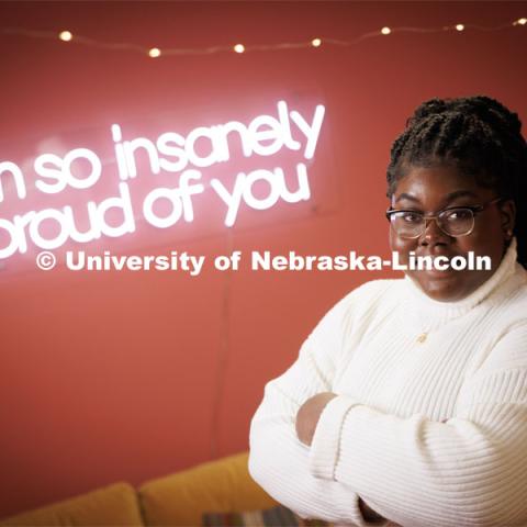 Odelia Amenyah smiles for a photo in the College of Journalism's Experience Lab. Amenyah is a senior in journalism and advertising/public relations, for Black History Month feature story. January 31, 2023. Photo by Craig Chandler / University Communication.