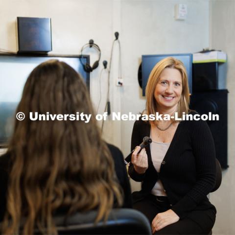 Audiologist Stacie Ray performs a hearing check in the Barkley Clinic. January 31, 2023. Photo by Craig Chandler / University Communication.