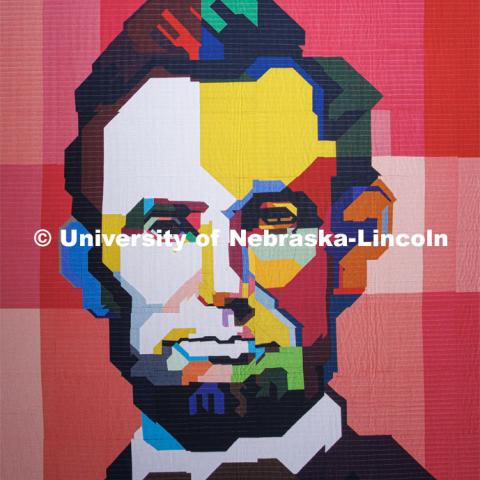 A quilt depicting Abraham Lincoln is on display in the lobby of the Quilt Center. February 8, 2023. Photo by Craig Chandler / University Communication.