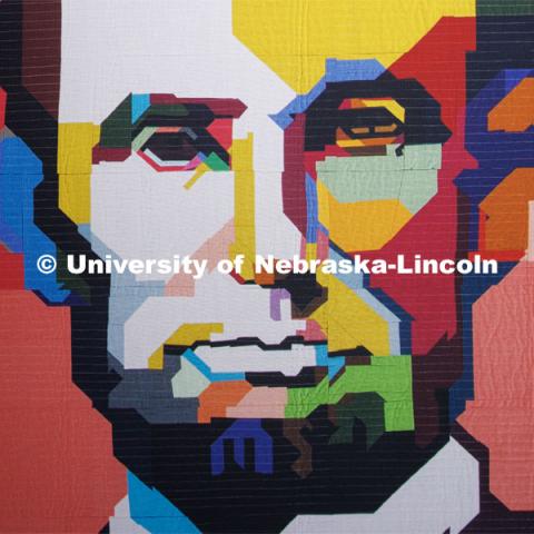 A quilt depicting Abraham Lincoln is on display in the lobby of the Quilt Center. February 8, 2023. Photo by Craig Chandler / University Communication.