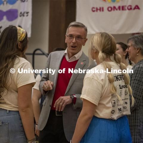 Chancellor Ronnie Green talks to students during Huskerthon. University of Nebraska–Lincoln students raised $118,208 during the annual HuskerThon on Feb. 25. Also known as Dance Marathon, the event is part of a nationwide fundraiser supporting Children’s Miracle Network Hospitals. The annual event, which launched in 2006, is the largest student philanthropic event on campus. The mission of the event encourages participants to, “dance for those who can’t.” All funds collected by the Huskers benefit the Children’s Hospital and Medical Center in Omaha. February 25, 2023. Photo by Blaney Dreifurst for University Communication.