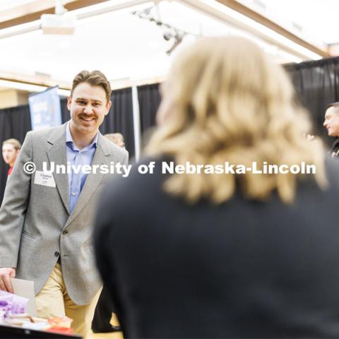 Clayton Meder talks with a recruiter at the Career and Internship Fair in Nebraska Union. February 27, 2023. Photo by Craig Chandler / University Communication.