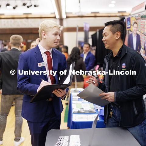 Max Sievenpiper talks with a recruiter from Union Pacific Railroad at the Career and Internship Fair in the Nebraska Union. February 28, 2023. Photo by Craig Chandler / University Communication.