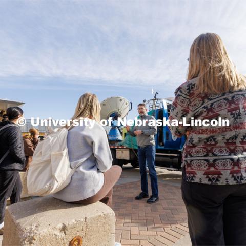 Adam Houston, Professor of Earth and Atmospheric Sciences, explains the use of the mobile radar truck to Meterology 140 students. The Doppler on Wheels, part of the Flexible Array of Radars and Mesonets operated by the University of Illinois, is on campus this week so Adam Houston’s TORUS team can train with it. The DOW is also being demonstrated to the meteorology students. March 20, 2023. Photo by Craig Chandler / University Communication.